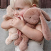 Child holding maileg plush bunny